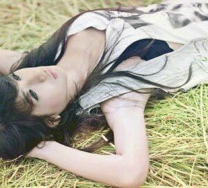 Girl Lying On Grass