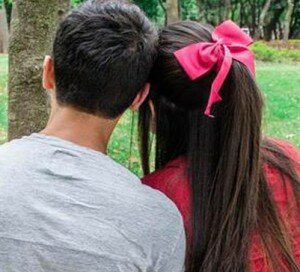 Couple facing tree
